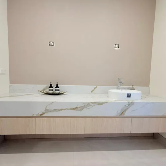 Bathroom vanity with engineered stone countertop and tiles, Verona Ceramic project gallery.