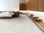 Espera Cream Carving Glaze Porcelain Tile flooring in a modern bedroom interior design.