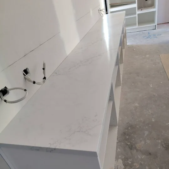 Engineered stone benchtop installation in modern kitchen renovation project