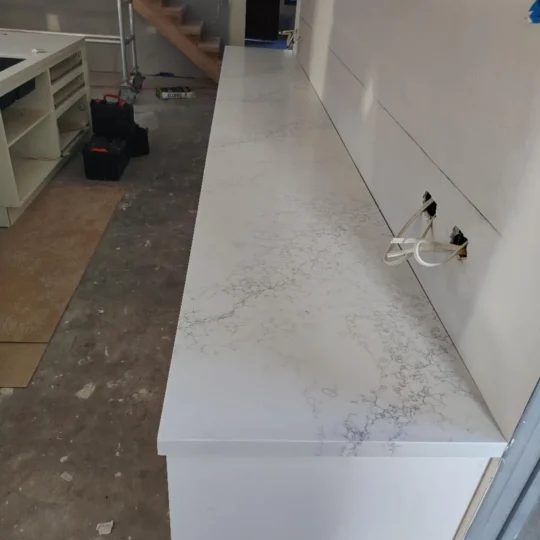 Engineered stone benchtop installation in Melbourne renovation project and Verona Ceramic project gallery.