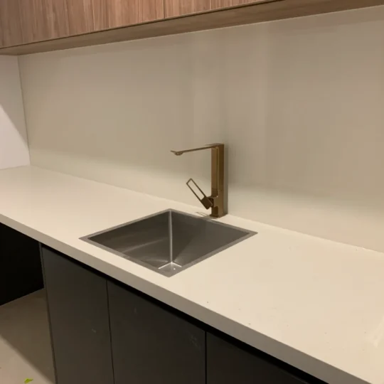 Modern bathroom featuring Verona Ceramic engineered stone benchtop and sink.