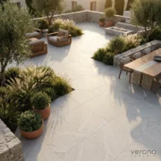 Outdoor entertainment area with grey stone look tile and patio furniture.