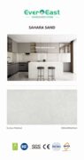 Sahara Sand engineered stone slab in modern kitchen setting, showcasing light grey veining and premium surface.