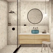 Bathroom interior featuring Bedrock Ivory Terrazzo Look Porcelain Tile flooring and walls.